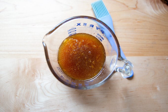 Brown sugar glaze in a measuring cup.