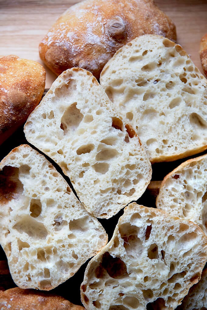 A pile of halved ciabatta rolls.