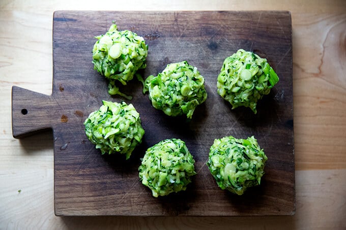 Portioned zucchini fritter balls.