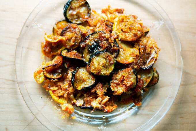 A slice of just-baked zucchini parmesan on a plate.