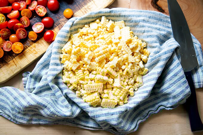 A bowl full of corn kernels.
