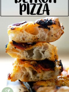 A crumb shot of a stack of 3 slices of Detroit pizza dough.