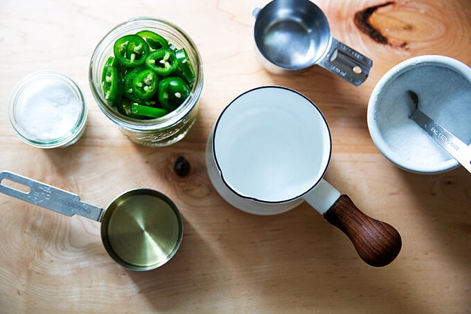Ingredients for pickled jalapeƱos on a countertop.