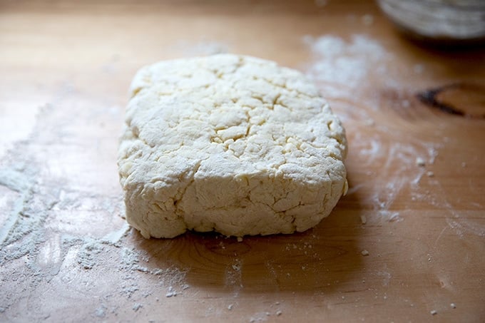 A block of biscuit dough on a countertop.