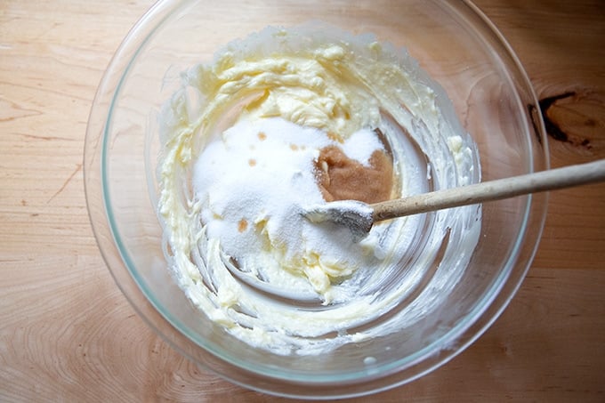 A bowl of softened butter, sugar, and vanilla.