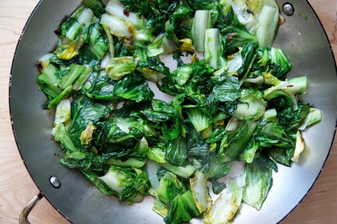 Sautéed escarole in a large skillet.