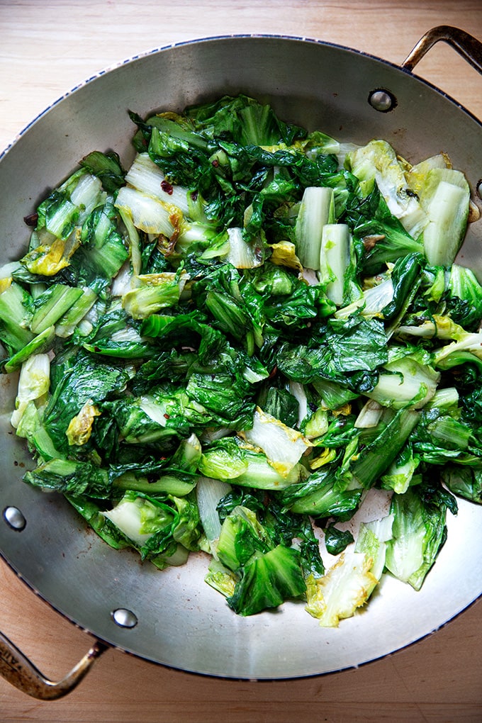 Sautéed escarole in a large skillet.