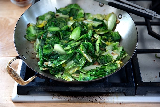 Sautéed escarole in a large skillet.