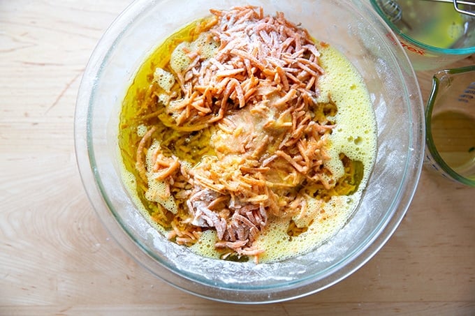 A bowl of unmixed carrot cake batter.