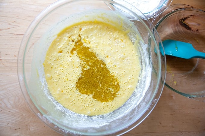 A bowl of orange and olive oil cake batter.