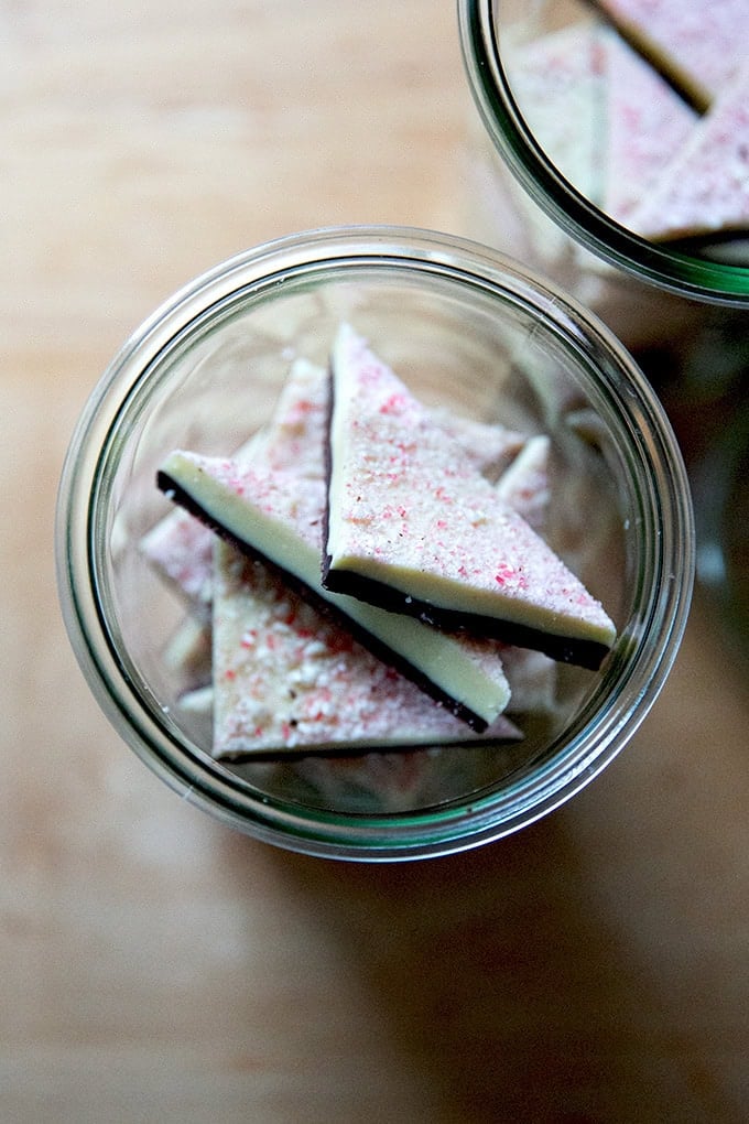 Overhead shot of peppermint bark in glass jars.
