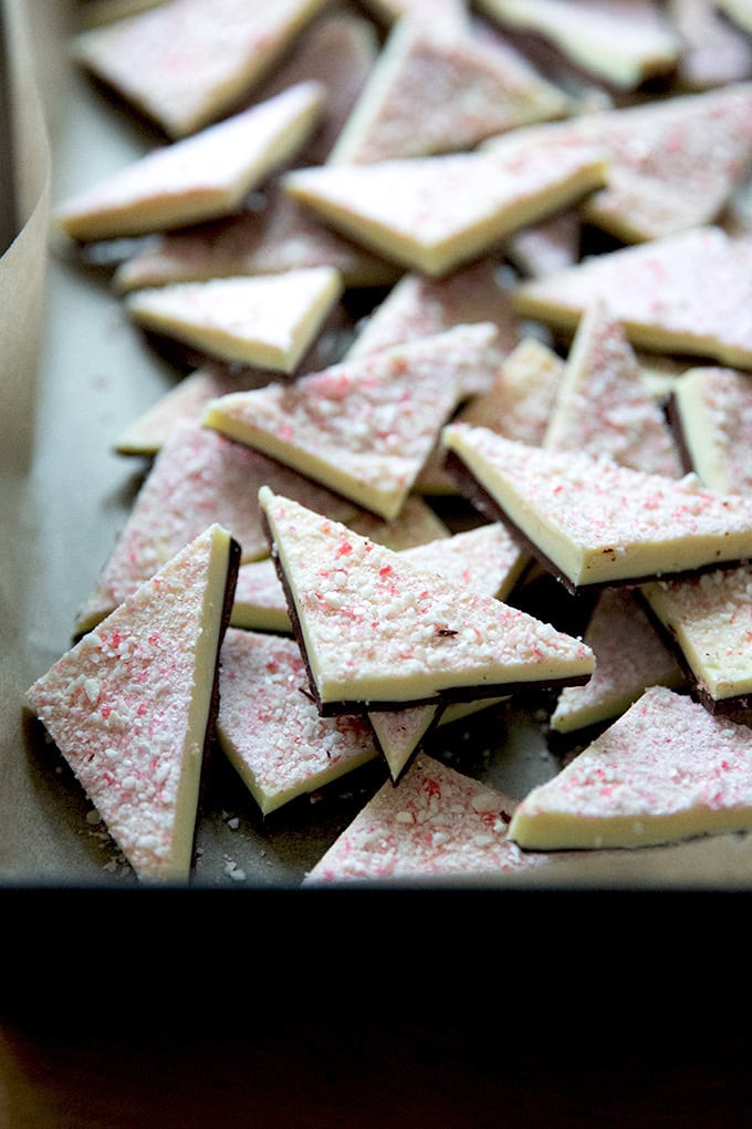 Peppermint bark cut into triangles in a 10x14-inch pan.