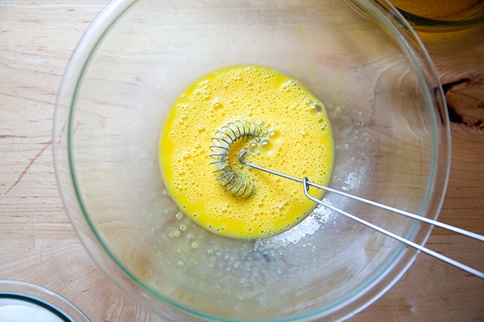 A bowl of beaten eggs.