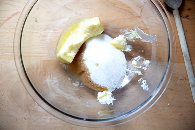 A bowl of butter, sugar and vanilla not yet mixed together.