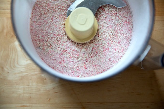 A food processor filled with crushed candy canes.