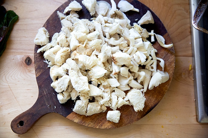 Chopped mushrooms on a cutting board.
