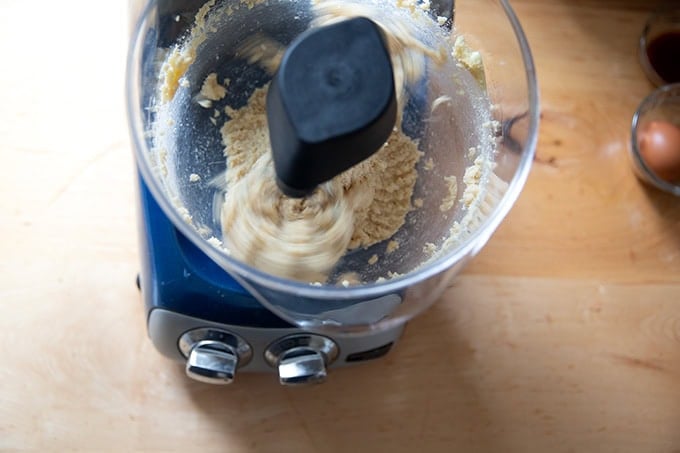 An Ankarsrum mixer filled with butter and sugar, creaming together.