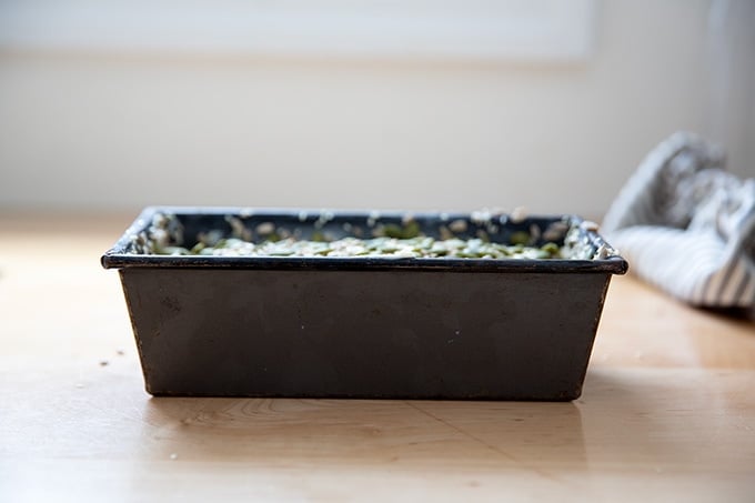 Three seed bread dough in a loaf pan, unrisen.