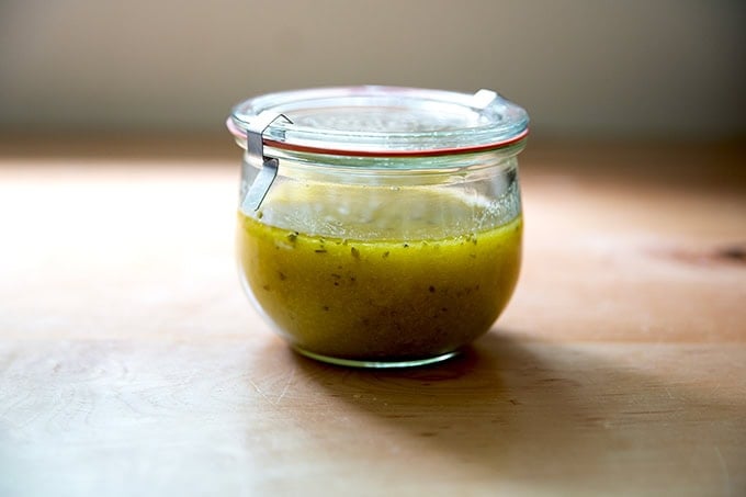 A Weck jar filled with Italian dressing.