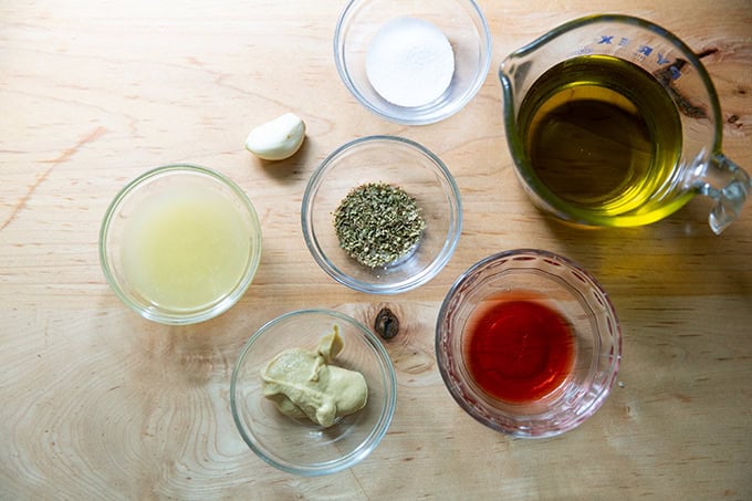 The ingredients to make Italian dressing measured out on a countertop.