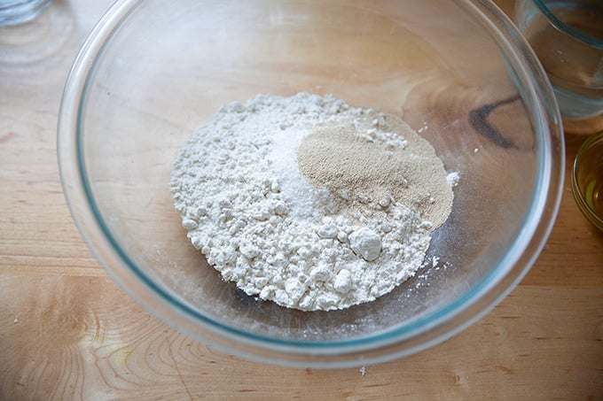 Dry ingredients to make gluten-free pizza dough in a large bowl.