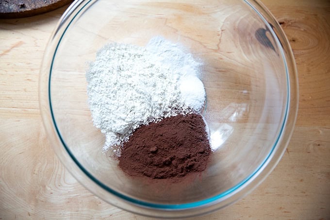 A bowl of flour, cocoa, salt, and baking powder.