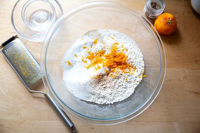 The dry ingredients to make hot cross buns in a large bowl.
