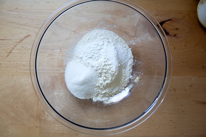 The dry ingredients to make sourdough discard waffles in a large bowl.