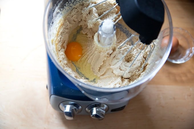 An Ankarsrum mixer filled with creamed butter and sugar, and 1 egg.