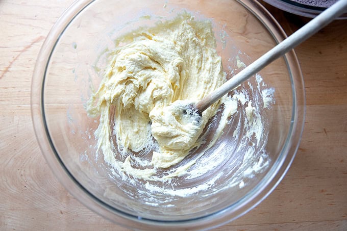 A bowl of creamed together butter, sugar, egg and vanilla.