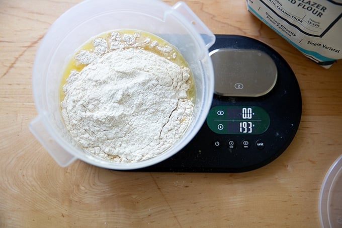 A 2-quart container holding pineapple juice and flour.