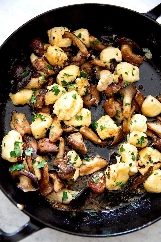 A skillet of ricotta gnocchi and wild mushrooms.