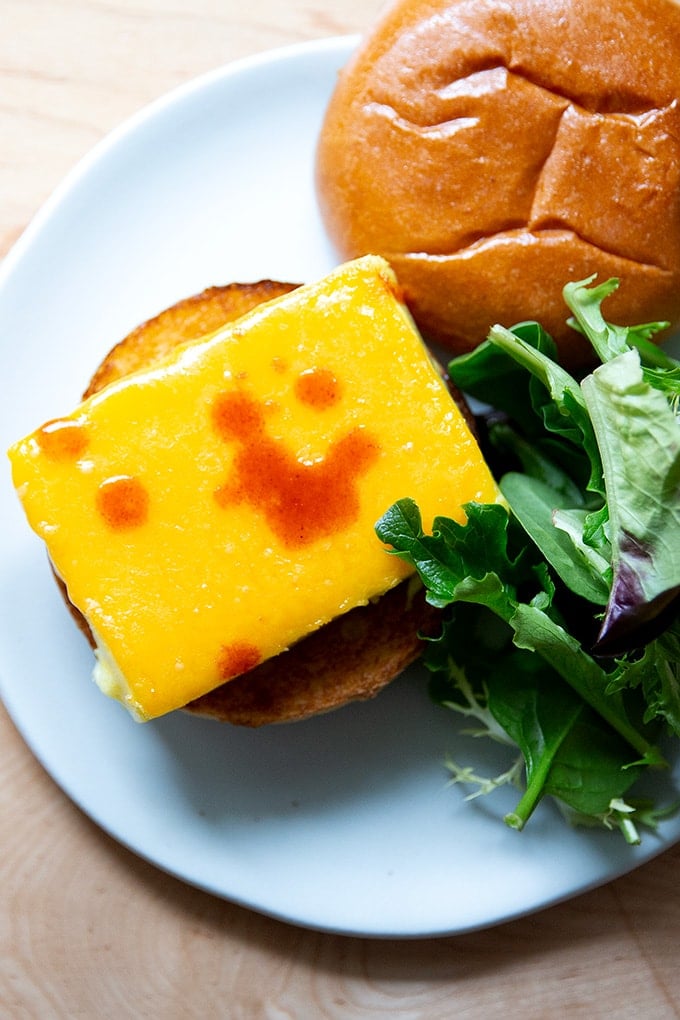 Brioche egg sandwich on a plate.