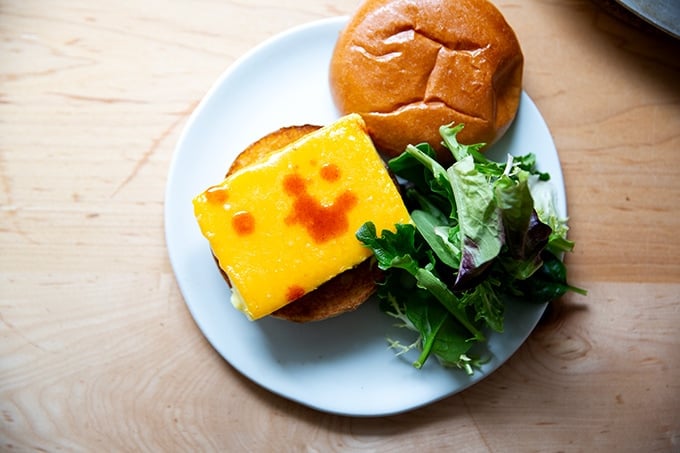 Brioche egg sandwich on a plate.