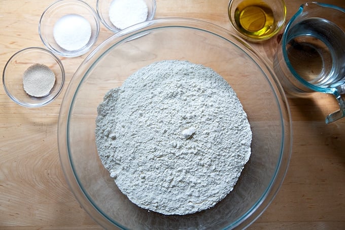 Ingredients to make pretzel rolls on a counter top.