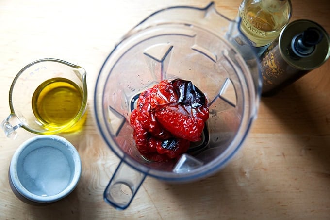 Roasted peppers, salt, and vinegar in a blender aside olive oil, vinegar, and salt.