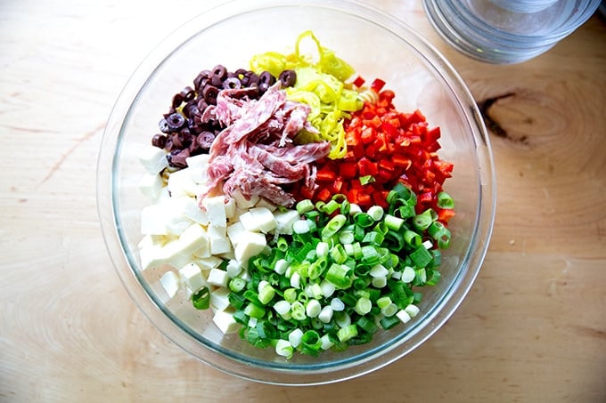 A bowl of the an untossed deli-style pasta salad.