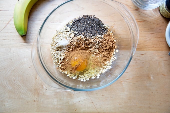 Banana-oat pancake ingredients in a bowl.