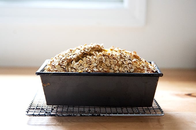 Just baked Irish brown bread, still in the pan on a cooling rack.