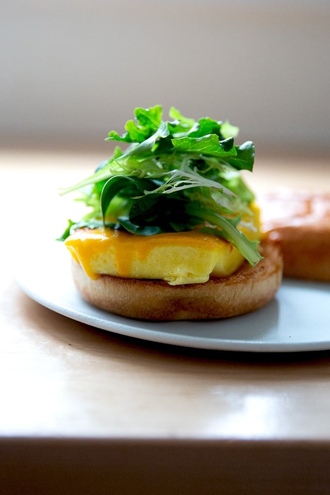 Brioche egg sandwich on a plate.