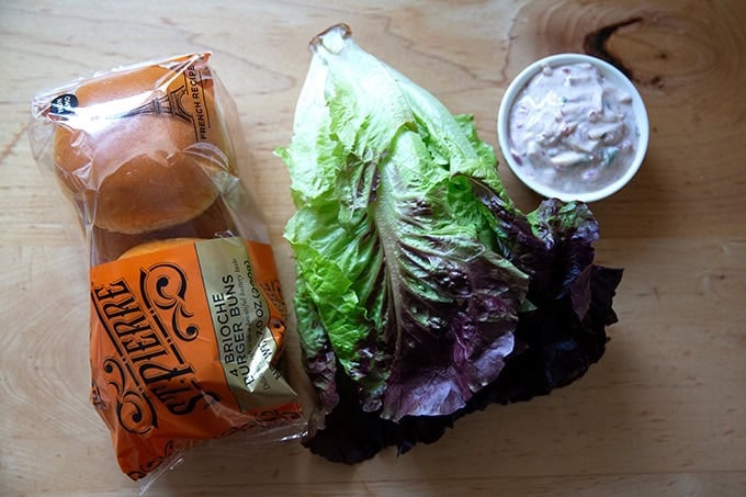 Brioche buns aside lettuce aside raita.