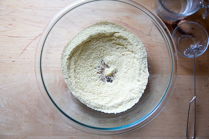 A bowl of masa harina and salt whisked together.
