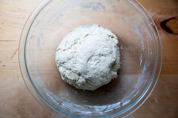 Mixed pretzel roll dough in a bowl.