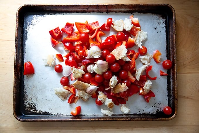 Ingredients to make romesco sauce on a sheet pan.