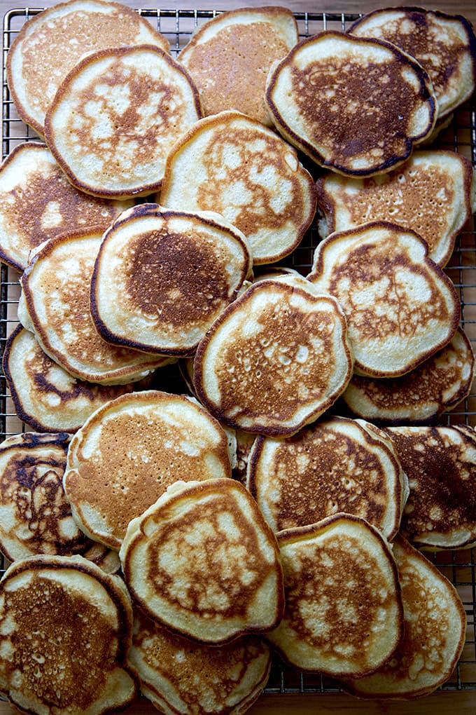 A cooling rack topped with sourdough discard pancakes.