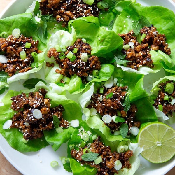 A plate of miso-lime tofu crumbles in lettuce cups.