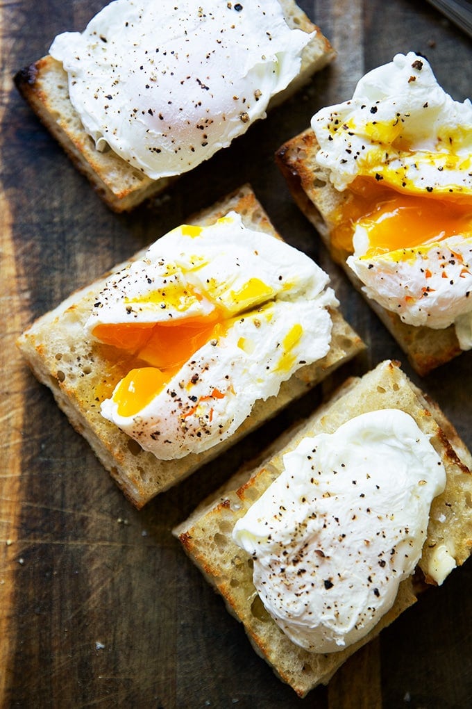 Four poached eggs on toast.
