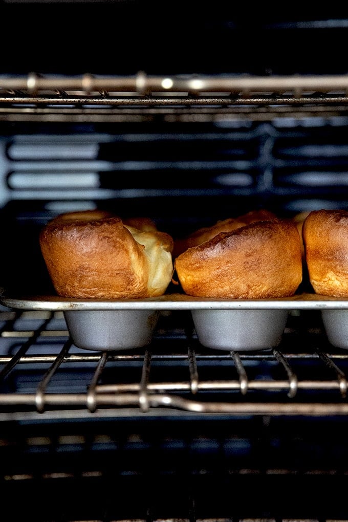 A tray of popovers in the oven.