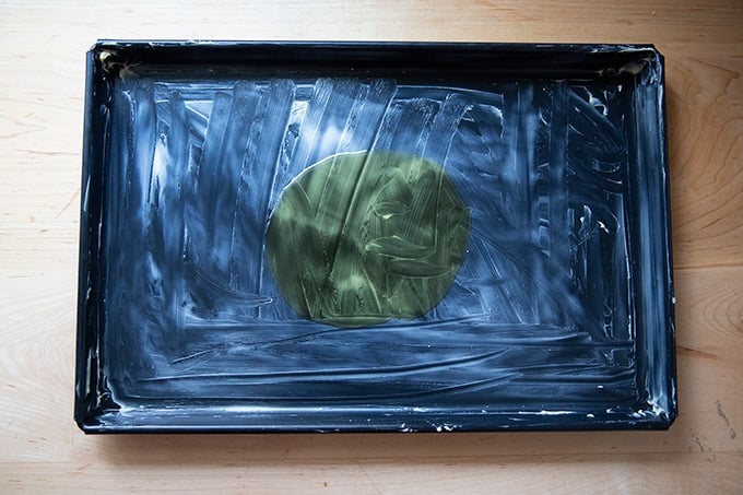 A buttered and oiled sheet pan.