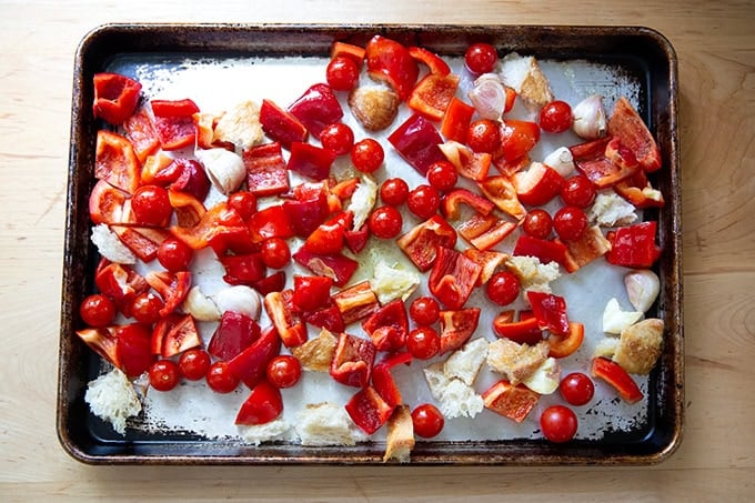 Ingredients to make romesco sauce on a sheet pan.